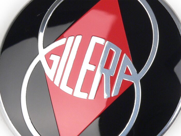 Badge horn cover -GILERA- Gilera Emblem - Runner (since 2006) (ZAPC461, ZAPC462, ZAPM461, ZAPM462, ZAPM463, ZAPM464)