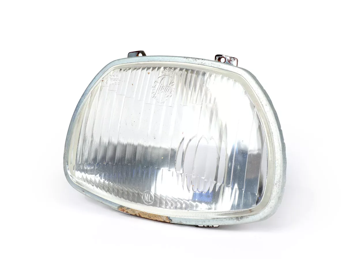 Koplamp -SIEM (NOS) trapezium - Vespa APE AD1, AE, AP ook geschikt voor Sprint150 (VLB1T), GL150 (VLA1T), GT125 (VNL2T), SS180 (VSC1T) - glas, incl. sierring, zonder koplampstekker