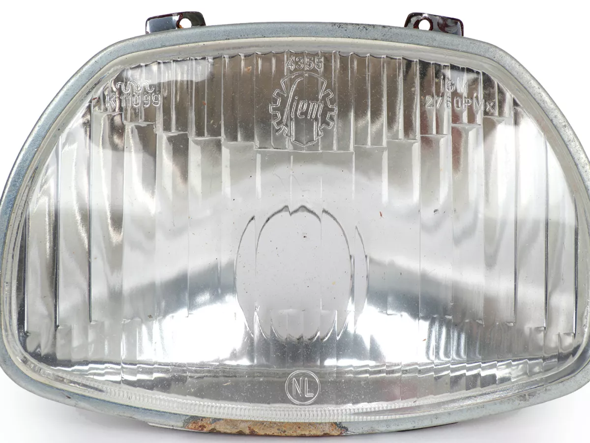 Koplamp -SIEM (NOS) trapezium - Vespa APE AD1, AE, AP ook geschikt voor Sprint150 (VLB1T), GL150 (VLA1T), GT125 (VNL2T), SS180 (VSC1T) - glas, incl. sierring, zonder koplampstekker