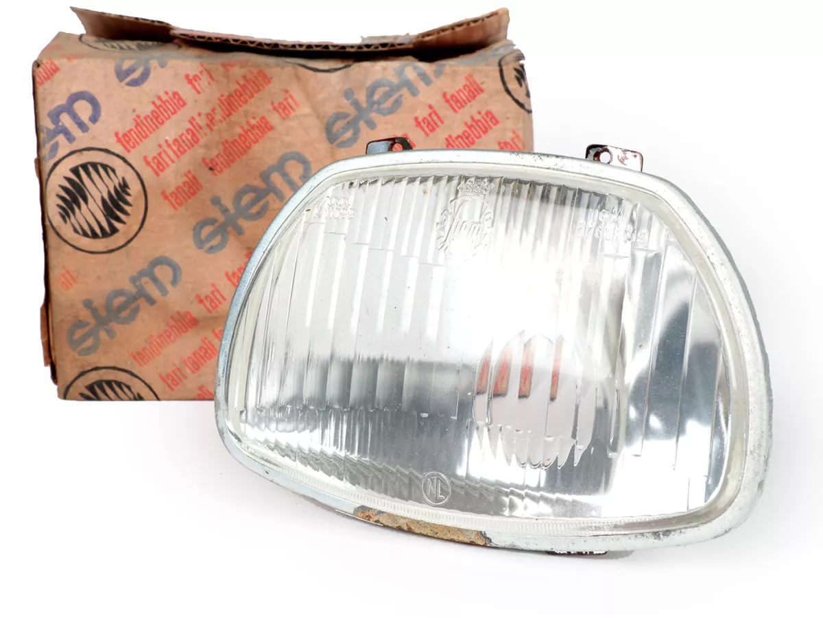Koplamp -SIEM (NOS) trapezium - Vespa APE AD1, AE, AP ook geschikt voor Sprint150 (VLB1T), GL150 (VLA1T), GT125 (VNL2T), SS180 (VSC1T) - glas, incl. sierring, zonder koplampstekker